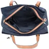 An open navy blue tote bag with tan leather accents, viewed from above. Voir les images du produit