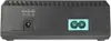 The back view of a black electronic device, likely a power adapter or charger, showing its ports and specifications. Produktbild-Vorschau