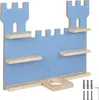 A blue wall-mounted shelf unit shaped like a castle. Náhled obrázku produktu