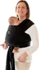 A woman is wearing a black baby wrap carrier with a baby inside. Produktbild-Vorschau