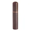 A dark brown wooden needle case with a gold band around the top. Produktbild-Vorschau