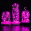 Three glass dome lights with pink LED string lights inside, displayed against a black background. Voir les images du produit