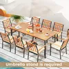 An outdoor dining set with a wooden table and chairs, set up on a patio with an umbrella. Náhled obrázku produktu