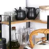 Kitchen counter with various items like a sugar bowl, creamer, oil bottle, and pepper grinders. Produktbild-Vorschau