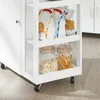 A close-up view of a white kitchen cart with shelves filled with food items. Produktbild-Vorschau