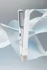 A white cordless hair straightener is displayed against a background of flowing white and blue fabric. Produktbild-Vorschau