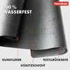 Close-up view of a dark gray material, likely a desk mat, showing its layered construction and water-resistant properties. Anteprima dell’immagine prodotto