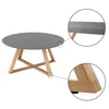 A round coffee table with a gray top and wooden legs. Náhled obrázku produktu