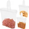 Three clear plastic storage containers filled with different food items: kidney beans, cereal flakes, and raisins. Produktbild-Vorschau