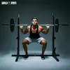 A man is performing a squat exercise with a barbell on a squat rack. Produktbild-Vorschau