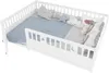A white wooden crib with blue bedding and decorative pillows. Voir les images du produit