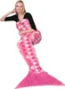 A woman is lying down wearing a mermaid tail blanket. Anteprima dell’immagine prodotto