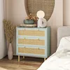 A bedroom scene with a nightstand and bed. Podgląd zdjęcia produktu
