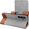 A grey flip phone case with brown leather accents, showing the camera cutout. Anteprima dell’immagine prodotto