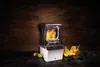 A blender is shown on a dark surface with fruits and vegetables around it, suggesting a healthy lifestyle. Anteprima dell’immagine prodotto