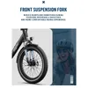 Close-up of an electric bicycle's front suspension and wheel, with a woman wearing a helmet in the background. Produktbild-Vorschau