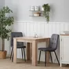 A dining set with a table and two chairs in a room. Voir les images du produit