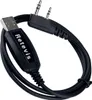 A black programming cable with a USB connector on one end and two audio jacks on the other. Produktbild-Vorschau