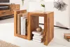 A wooden side table with books and decorative items in a living room setting. Produktbild-Vorschau