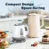 Two kettles and desserts on a kitchen counter. Produktbild-Vorschau