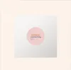 A white box with a pink circular logo containing text and a honeycomb pattern. Produktbild-Vorschau