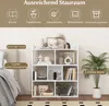 A white bookshelf filled with decorative items and books, next to a bed and a potted plant. The image includes text overlays highlighting storage capacity and features. Podgląd zdjęcia produktu