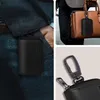 Collage of images showing a black RFID blocking pouch attached to a person's pocket, a handbag, and a close-up of its hardware. Anteprima dell’immagine prodotto