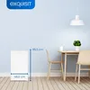 A white refrigerator is shown next to a dining table with two chairs in a room with light blue walls and a wooden floor. Produktbild-Vorschau
