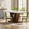 A dining table set in a dining room with a brick wall and a large window. Anteprima dell’immagine prodotto