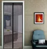 A magnetic mosquito net is installed on a door, showing a glimpse of a bedroom interior. A chair and a framed picture are visible on the wall. Náhled obrázku produktu