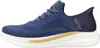 A side view of a blue Skechers slip-in sneaker with a white sole and gold accents. Voir les images du produit
