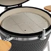 Close-up view of the interior of a kamado grill with a cooking grate. Produktbild-Vorschau