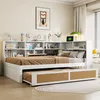 A white daybed with a pull-out trundle bed is shown in a room with a bookshelf headboard. Voir les images du produit