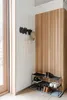 An entryway with a coat rack, tote bag, hat, and shoe rack. Náhľad obrázku produktu