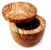 A wooden bowl with a lid, made of olive wood, on a white background. Produktbild-Vorschau