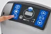 A close-up of a person's finger touching a control panel of a whirlpool spa. Produktbild-Vorschau