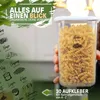 A hand holds a clear plastic food storage container filled with pasta, with a green overlay on the left side of the image featuring text and illustrations of various food items. Anteprima dell’immagine prodotto