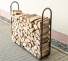 A metal log rack filled with firewood, placed on a paved outdoor area next to a building. Náhled obrázku produktu