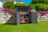 An outdoor storage box is open, revealing gardening tools and a lawnmower inside, set against a backdrop of a house and garden. Náhled obrázku produktu