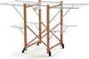 A multi-tiered drying rack with wooden frame and white metal drying rods, shown against a white background. Anteprima dell’immagine prodotto