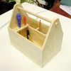 A wooden toolbox kit with tools inside, placed on a white surface. Produktbild-Vorschau