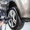 A mechanic is using an impact wrench to tighten the lug nuts on a car wheel. Náhľad obrázku produktu