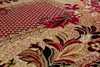 A close-up view of a patterned carpet with floral and geometric designs. Náhled obrázku produktu