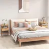 A bedroom scene featuring a bed and nightstands. Podgląd zdjęcia produktu