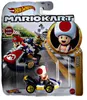 A Hot Wheels Mario Kart Toad toy car in its packaging, with a background illustration of a race. Náhled obrázku produktu