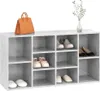 A shoe bench with various shoes and a handbag on top, against a white background. Náhled obrázku produktu