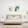 A bedroom scene with a bed and two nightstands. Produktbild-Vorschau