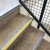 A close-up view of stair treads with anti-slip profiles. Anteprima dell’immagine prodotto