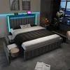 A modern bedroom with a bed featuring LED lighting and storage drawers. Produktbild-Vorschau