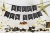 A table set up for a New Year's Eve party with decorations, cupcakes, and drinks. Podgląd zdjęcia produktu